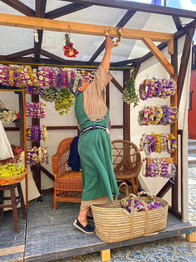 Artisan Selling Floral Crowns at the Obidos Medieval Festival